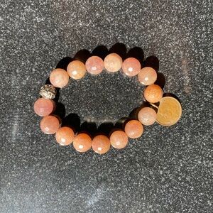 Pink moonstone healing crystal beaded stretch bracelet for women with a coin.